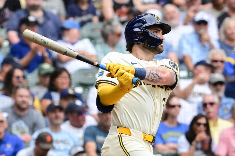 Aug 29, 2024; Milwaukee, Wisconsin, USA; Milwaukee Brewers right fielder Garrett Mitchell (5) hits a solo home run in the second inning against the San Francisco Giants  at American Family Field. Mandatory Credit: Benny Sieu-USA TODAY Sports