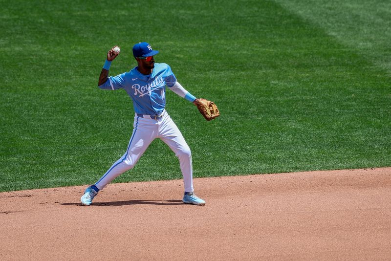 Jun 26, 2024; Kansas City, Missouri, USA; Kansas City Royals third base Maikel Garcia (11) throws to first base against the Miami Marlins during the fifth inning at Kauffman Stadium. Mandatory Credit: William Purnell-USA TODAY Sports