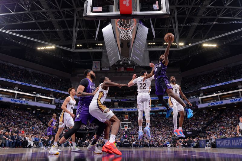 SACRAMENTO, CA - JANUARY 7:  Malik Monk #0 of the Sacramento Kings goes to the basket during the game on January 7, 2024 at Golden 1 Center in Sacramento, California. NOTE TO USER: User expressly acknowledges and agrees that, by downloading and or using this Photograph, user is consenting to the terms and conditions of the Getty Images License Agreement. Mandatory Copyright Notice: Copyright 2024 NBAE (Photo by Rocky Widner/NBAE via Getty Images)