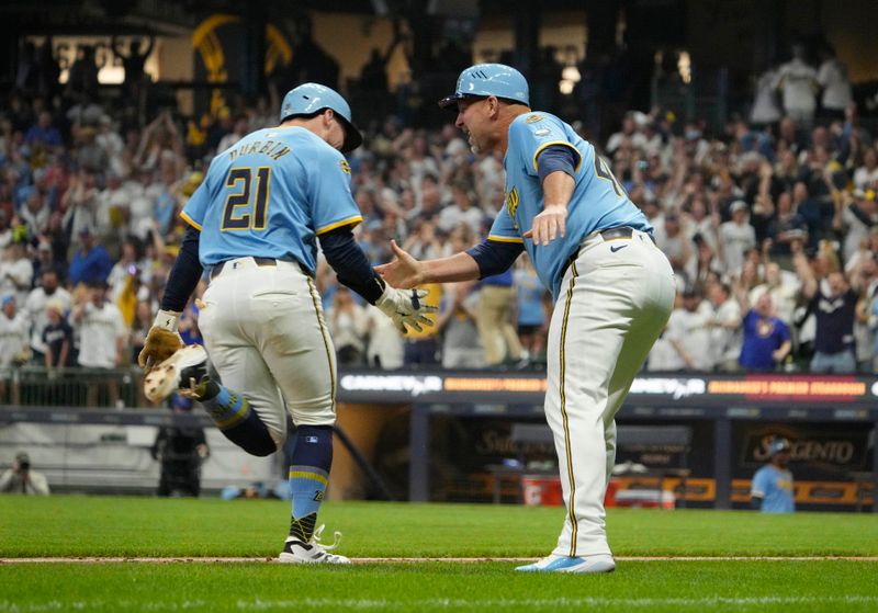 Jun 7, 2025; Milwaukee, Wisconsin, USA; Milwaukee Brewers third base coach Jason Lane (40) congratulates Milwaukee Brewers third base Caleb Durbin (21) after hitting a walk off home run against the San Diego Padres in the ninth inning at American Family Field. Mandatory Credit: Michael McLoone-Imagn Images