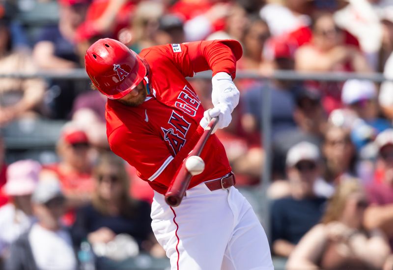 Mar 16, 2025; Tempe, Arizona, USA; Los Angeles Angels outfielder Taylor Ward hits the ball against the San Diego Padres during a spring training game at Tempe Diablo Stadium. Mandatory Credit: Mark J. Rebilas-Imagn Images