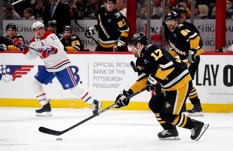 Feb 22, 2024; Pittsburgh, Pennsylvania, USA; Pittsburgh Penguins right wing Bryan Rust (17) skates with the puck against the Montreal Canadiens during the second period at PPG Paints Arena.  The Penguins won 4-1. Mandatory Credit: Charles LeClaire-USA TODAY Sports