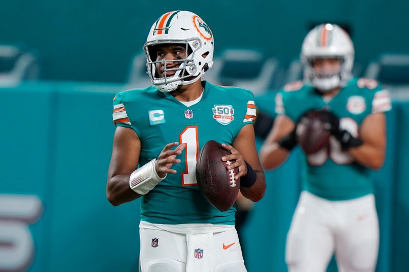 Miami Dolphins quarterback Tua Tagovailoa (1) warms up before an NFL football game against the Pittsburgh Steelers, Sunday, Oct. 23, 2022, in Miami Gardens, Fla. (AP Photo/Wilfredo Lee )