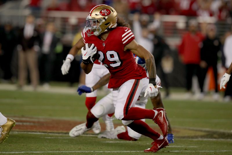 San Francisco 49ers safety Talanoa Hufanga (29) runs after an interception during an NFL football game against the New York Giants, Thursday, Sept. 21, 2023, in Santa Clara, Calif. (AP Photo/Scot Tucker)