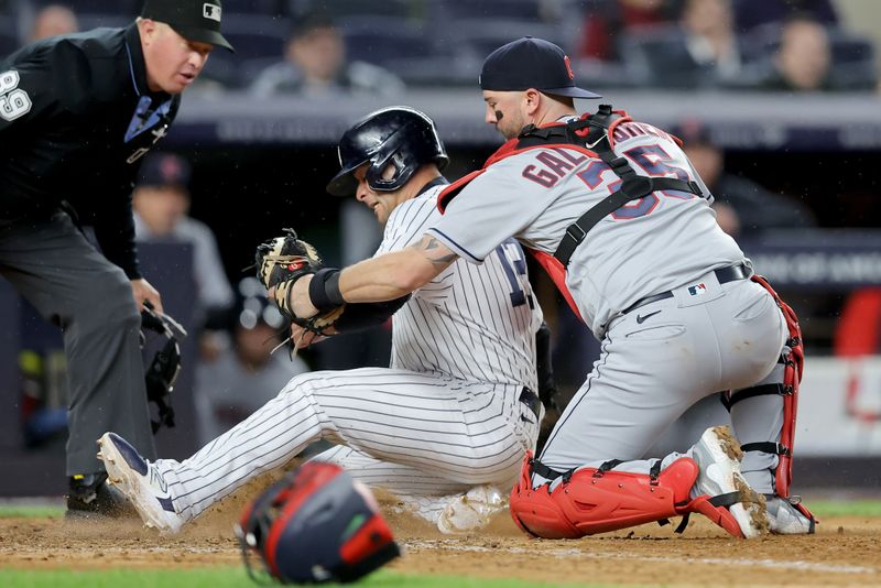 May 3, 2023; Bronx, New York, USA; New York Yankees left fielder Isiah Kiner-Falefa (12) is tagged out by Cleveland Guardians catcher Cam Gallagher (35) trying to score on a ground ball by Yankees shortstop Anthony Volpe (not pictured) during the eighth inning at Yankee Stadium. Mandatory Credit: Brad Penner-USA TODAY Sports