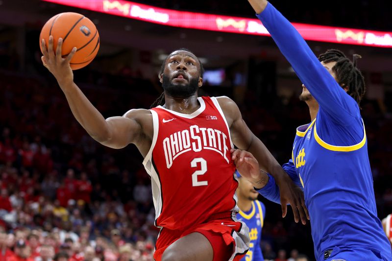 Nov 29, 2024; Columbus, Ohio, USA;  Ohio State Buckeyes guard Bruce Thornton (2) drives past Pittsburgh Panthers forward Cameron Corhen (2) during the second half at Value City Arena. Mandatory Credit: Joseph Maiorana-Imagn Images