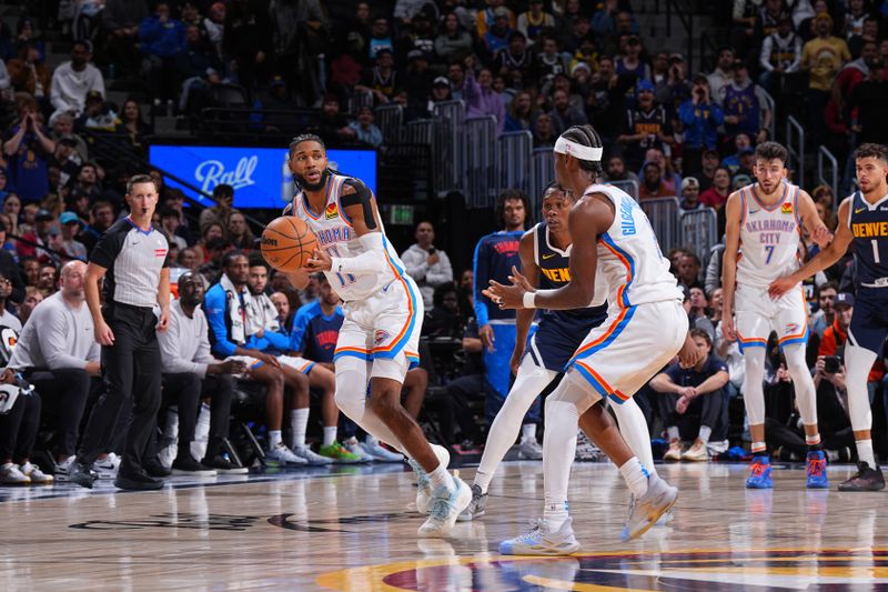 DENVER, CO - NOVEMBER 6: Isaiah Joe #11 of the Oklahoma City Thunder passes the ball during the game against the Denver Nuggets on November 6, 2024 at Ball Arena in Denver, Colorado. NOTE TO USER: User expressly acknowledges and agrees that, by downloading and/or using this Photograph, user is consenting to the terms and conditions of the Getty Images License Agreement. Mandatory Copyright Notice: Copyright 2024 NBAE (Photo by Garrett Ellwood/NBAE via Getty Images)