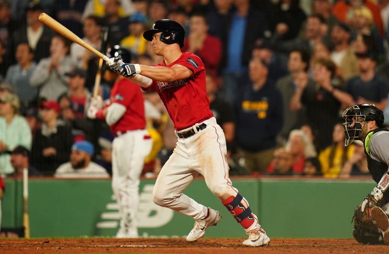 Jun 14, 2023; Boston, Massachusetts, USA; Boston Red Sox left fielder Rob Refsnyder (30) hits a triple to center field to drive in two runs against the Colorado Rockies in the seventh inning at Fenway Park. Mandatory Credit: David Butler II-USA TODAY Sports