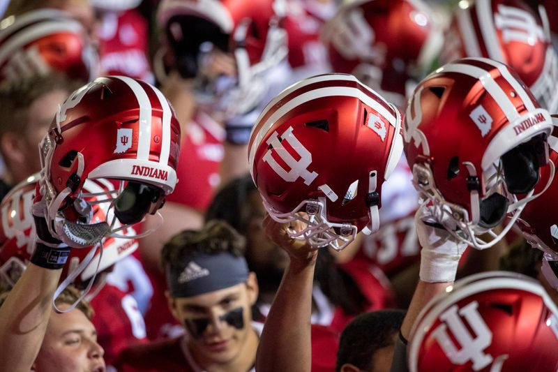 Oct 24, 2020; Bloomington, Indiana, USA;  Indiana Hoosiers raise their helmets after the game at Memorial Stadium. The Indiana Hoosiers defeated the Penn State Nittany Lions 36 to 35.  Mandatory Credit: Marc Lebryk-USA TODAY Sports