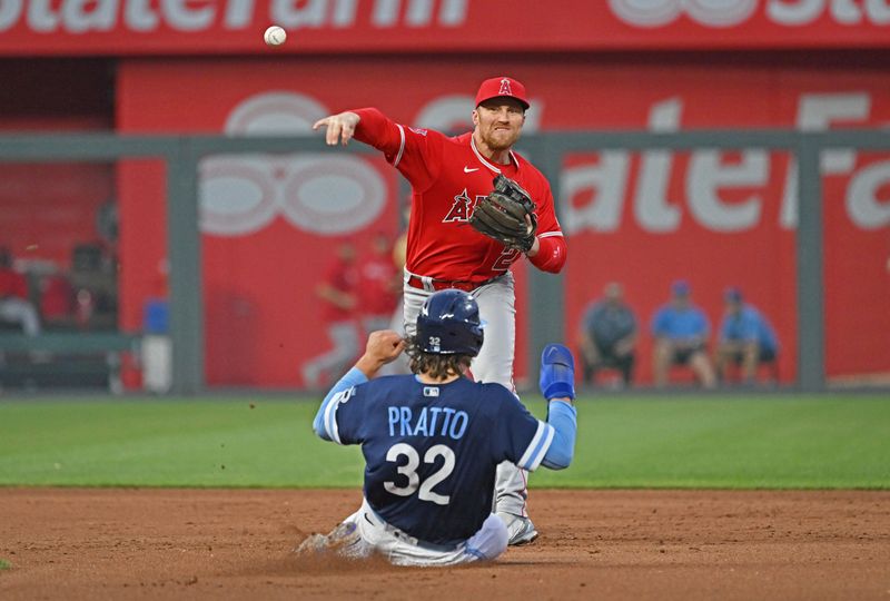 Jun 16, 2023; Kansas City, Missouri, USA; Los Angeles Angels second baseman Brandon Drury (23) turns a double play in the third inning over Kansas City Royals Nick Pratto (32) at Kauffman Stadium. Mandatory Credit: Peter Aiken-USA TODAY Sports