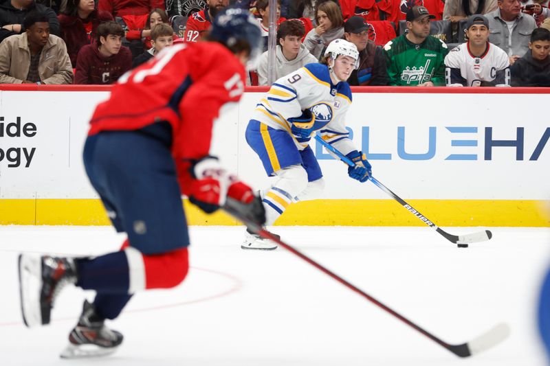 Nov 22, 2023; Washington, District of Columbia, USA; Buffalo Sabres left wing Zach Benson (9) skates with the puck as Washington Capitals center Dylan Strome (17) chases in the first period at Capital One Arena. Mandatory Credit: Geoff Burke-USA TODAY Sports