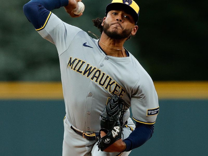 Apr 8, 2025; Denver, Colorado, USA; Milwaukee Brewers starting pitcher Freddy Peralta (51) pitches in the first inning against the Colorado Rockies at Coors Field. Mandatory Credit: Isaiah J. Downing-Imagn Images