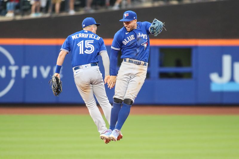 Jun 3, 2023; New York City, New York, USA;  Toronto Blue Jays second baseman Whit Merrifield (15) and right fielder George Springer (4) celebrate after defeating the New York Mets 2-1 at Citi Field. Mandatory Credit: Wendell Cruz-USA TODAY Sports