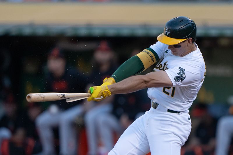 Jul 5, 2024; Oakland, California, USA;  Oakland Athletics first base Tyler Soderstrom (21) breaks his bat during the first inning against the Baltimore Orioles at Oakland-Alameda County Coliseum. Mandatory Credit: Stan Szeto-USA TODAY Sports