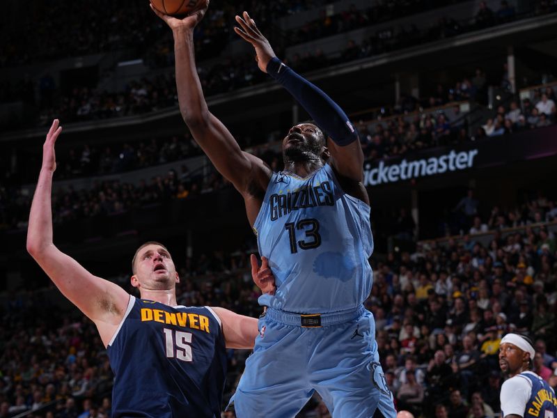 DENVER, CO - MARCH 25: Jaren Jackson Jr. #13 of the Memphis Grizzlies drives to the basket during the game against the Denver Nuggets on March 25, 2024 at the Ball Arena in Denver, Colorado. NOTE TO USER: User expressly acknowledges and agrees that, by downloading and/or using this Photograph, user is consenting to the terms and conditions of the Getty Images License Agreement. Mandatory Copyright Notice: Copyright 2024 NBAE (Photo by Bart Young/NBAE via Getty Images)