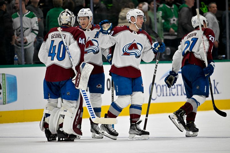 Jan 4, 2024; Dallas, Texas, USA; Colorado Avalanche goaltender Alexandar Georgiev (40) and center Ross Colton (20) celebrate the game winning goal scored by center Nathan MacKinnon (29) during the overtime period against the Dallas Stars at the American Airlines Center. Mandatory Credit: Jerome Miron-USA TODAY Sports