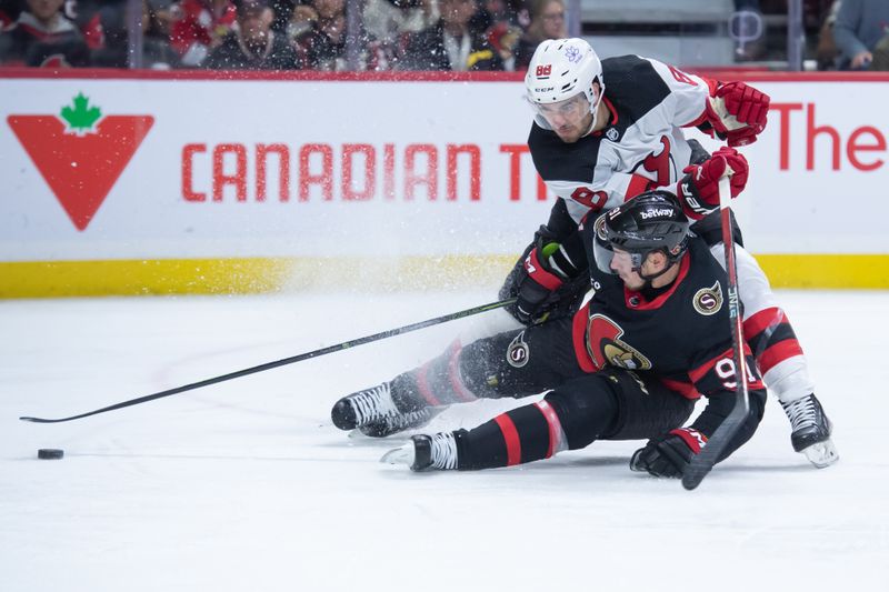 Dec 29, 2023; Ottawa, Ontario, CAN; New Jersey Devils center Kevin Bahl (88) battles with Ottawa Senators right wing Vladimir Tarasenko (91) in the first period at the Canadian Tire Centre. Mandatory Credit: Marc DesRosiers-USA TODAY Sports