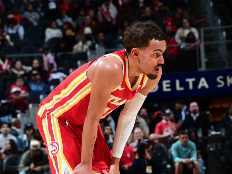 ATLANTA, GA - JANUARY 28: Trae Young #11 of the Atlanta Hawks looks on during the game against the Toronto Raptors on January 28, 2024 at State Farm Arena in Atlanta, Georgia.  NOTE TO USER: User expressly acknowledges and agrees that, by downloading and/or using this Photograph, user is consenting to the terms and conditions of the Getty Images License Agreement. Mandatory Copyright Notice: Copyright 2024 NBAE (Photo by Scott Cunningham/NBAE via Getty Images)