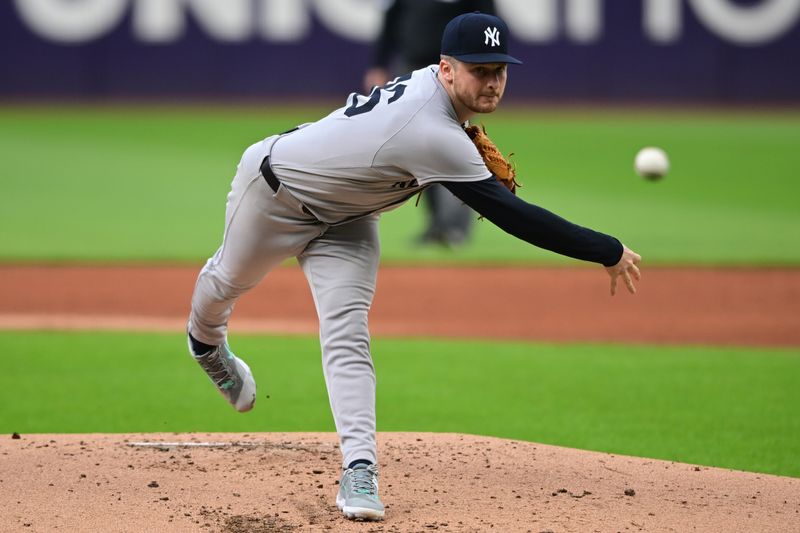 Apr 21, 2025; Cleveland, Ohio, USA; New York Yankees starting pitcher Clarke Schmidt (36) throws a pitch during the first inning against the Cleveland Guardians at Progressive Field. Mandatory Credit: David Dermer-Imagn Images