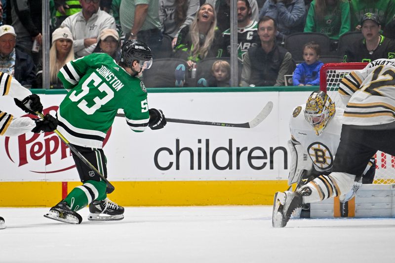 Nov 6, 2023; Dallas, Texas, USA; Boston Bruins goaltender Jeremy Swayman (1) stops a shot by Boston Bruins left wing Brad Marchand (63) during the third period at the American Airlines Center. Mandatory Credit: Jerome Miron-USA TODAY Sports