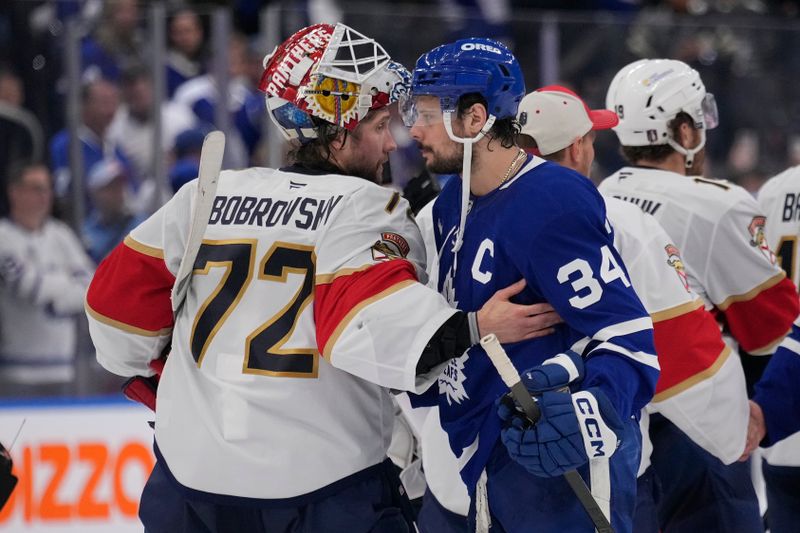 May 18, 2025; Toronto, Ontario, CAN; Toronto Maple Leafs forward Auston Matthews (34) and Florida Panthers goaltender Sergei Bobrovsky (72) shake hands after game seven of the second round of the 2025 Stanley Cup Playoffs at Scotiabank Arena. Mandatory Credit: John E. Sokolowski-Imagn Images