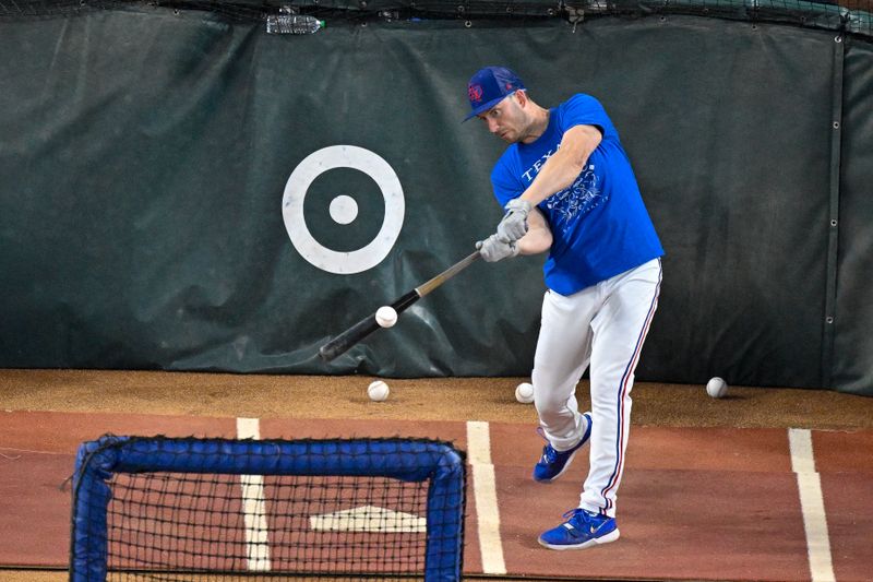 Oct 28, 2023; Arlington, Texas, USA; Texas Rangers designated hitter Mitch Garver (18) takes batting practice before the game between the Texas Rangers and the Arizona Diamondbacks in game two of the 2023 World Series at Globe Life Field. Mandatory Credit: Jerome Miron-USA TODAY Sports