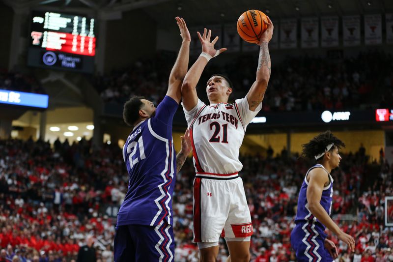 Feb 20, 2024; Lubbock, Texas, USA;  Texas Tech Red Raiders forward KyeRon Lindsay (21) shoots over TCU Horned Frogs forward JaKobe Coles (21) in the second half at United Supermarkets Arena. Mandatory Credit: Michael C. Johnson-USA TODAY Sports