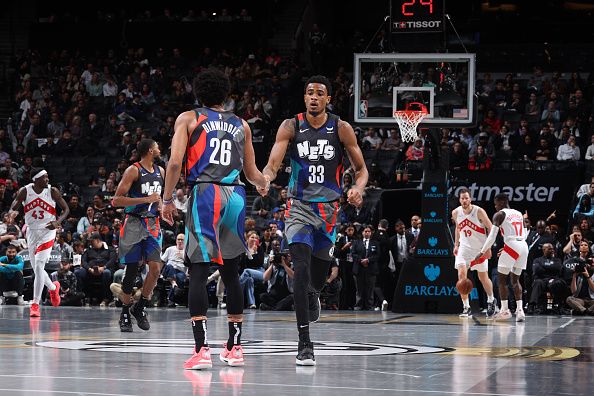 BROOKLYN, NY - NOVEMBER 28: Nicolas Claxton #33 high fives Spencer Dinwiddie #26 of the Brooklyn Nets during the game against the Toronto Raptors during the In-Season Tournament on November 28, 2023 at Barclays Center in Brooklyn, New York. NOTE TO USER: User expressly acknowledges and agrees that, by downloading and or using this Photograph, user is consenting to the terms and conditions of the Getty Images License Agreement. Mandatory Copyright Notice: Copyright 2023 NBAE (Photo by Nathaniel S. Butler/NBAE via Getty Images)