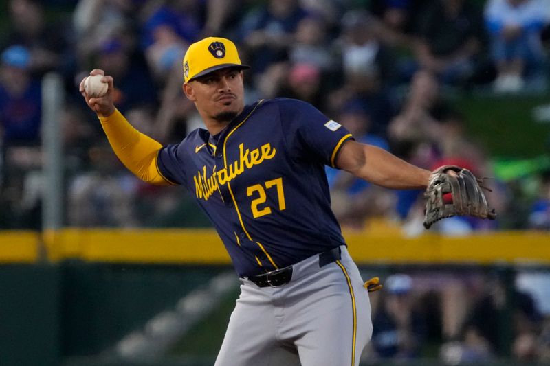 Mar 12, 2024; Mesa, Arizona, USA; Milwaukee Brewers Willy Adames (27) makes the play against the Chicago Cubs in the first inning at Sloan Park. Mandatory Credit: Rick Scuteri-USA TODAY Sports