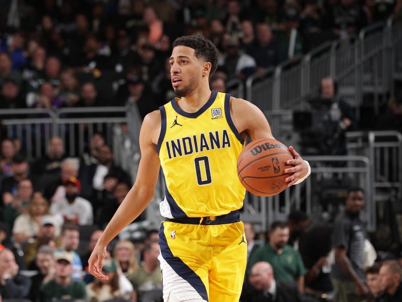 MILWAUKEE, WI - APRIL 27: Tyrese Haliburton #0 of the Indiana Pacers dribbles the ball during the game against the Milwaukee Bucks during Round One Game Four of the 2025 NBA Playoffs on April 27, 2025 at Fiserv Forum Center in Milwaukee, Wisconsin. NOTE TO USER: User expressly acknowledges and agrees that, by downloading and or using this Photograph, user is consenting to the terms and conditions of the Getty Images License Agreement. Mandatory Copyright Notice: Copyright 2025 NBAE (Photo by Gary Dineen/NBAE via Getty Images).