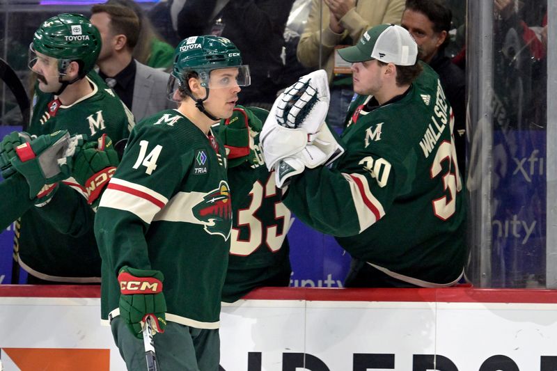 Jan 23, 2024; Saint Paul, Minnesota, USA;  Minnesota Wild forward Joel Eriksson Ek (14) celebrates his goal against the Washington Capitals with goalie Jesper Wallstedt (30) during the third period at Xcel Energy Center. Mandatory Credit: Nick Wosika-USA TODAY Sports