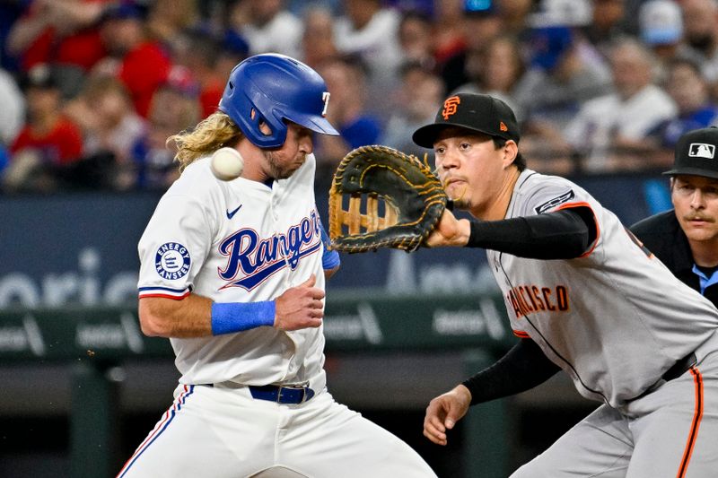 Jun 8, 2024; Arlington, Texas, USA; Texas Rangers left fielder Travis Jankowski (16) steps back to first base to avoid the pickoff throw to San Francisco Giants first baseman Wilmer Flores (41) during the second inning at Globe Life Field. Mandatory Credit: Jerome Miron-USA TODAY Sports