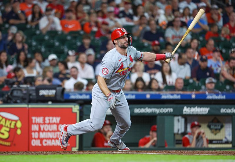 Jun 5, 2024; Houston, Texas, USA; St. Louis Cardinals first baseman Paul Goldschmidt (46) hits a single during the fourth inning against the Houston Astros at Minute Maid Park. Mandatory Credit: Troy Taormina-USA TODAY Sports