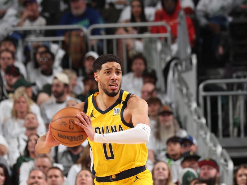 MILWAUKEE, WI - APRIL 23: Tyrese Haliburton #0 of the Indiana Pacers passes the ball during the game against the Milwaukee Bucks during Round One Game Two of the 2024 NBA Playoffs on April 23, 2024 at the Fiserv Forum Center in Milwaukee, Wisconsin. NOTE TO USER: User expressly acknowledges and agrees that, by downloading and or using this Photograph, user is consenting to the terms and conditions of the Getty Images License Agreement. Mandatory Copyright Notice: Copyright 2024 NBAE (Photo by Gary Dineen/NBAE via Getty Images).