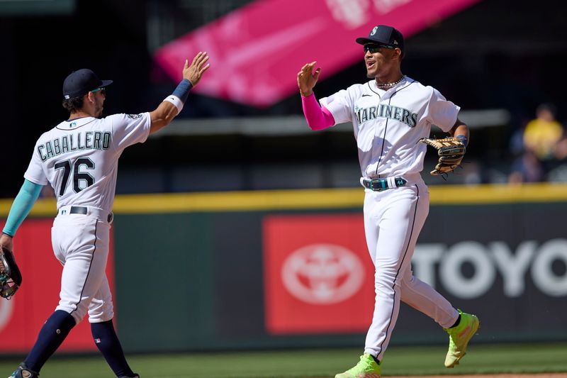 Aug 2, 2023; Seattle, Washington, USA; Seattle Mariners center fielder Julio Rodriguez  celebrates with Jose Caballero (76) a win over the Boston Red Sox at T-Mobile Park. Mandatory Credit: John Froschauer-USA TODAY Sports