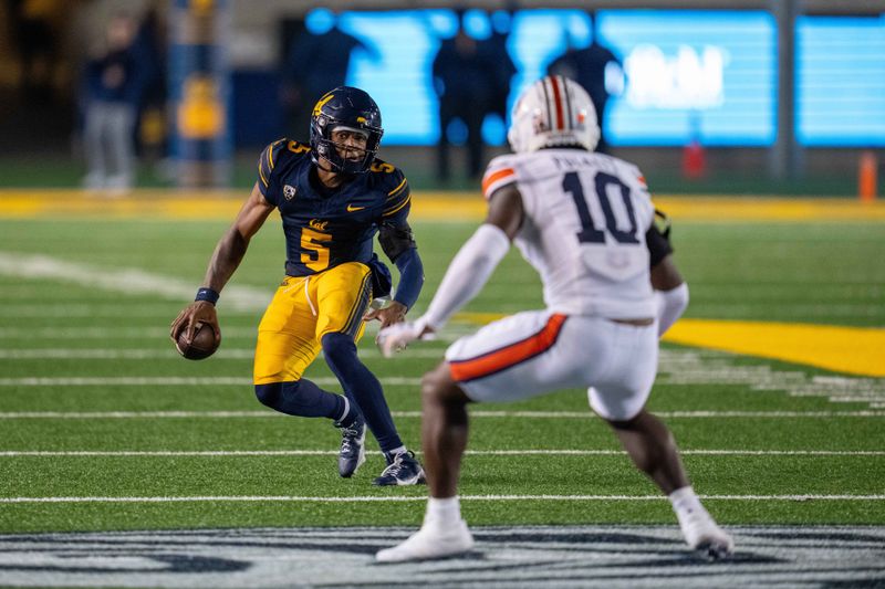 Sep 9, 2023; Berkeley, California, USA; California Golden Bears quarterback Sam Jackson V (5) rushes with the football against Auburn Tigers safety Zion Puckett (10) during the third quarter at California Memorial Stadium. Mandatory Credit: Neville E. Guard-USA TODAY Sports