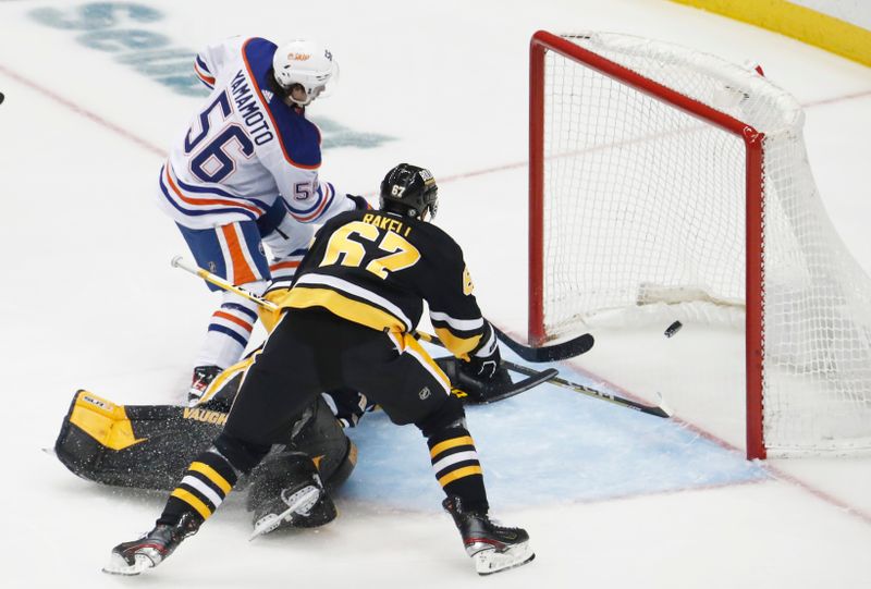 Feb 23, 2023; Pittsburgh, Pennsylvania, USA;  Edmonton Oilers right wing Kailer Yamamoto (56) scores a goal against the Pittsburgh Penguins during the second period at PPG Paints Arena. Mandatory Credit: Charles LeClaire-USA TODAY Sports