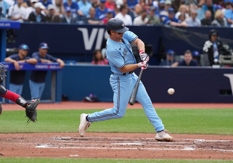 Aug 30, 2023; Toronto, Ontario, CAN; Toronto Blue Jays shortstop Ernie Clement (28) hits a single against the Washington Nationals during the fourth inning at Rogers Centre. Mandatory Credit: Nick Turchiaro-USA TODAY Sports