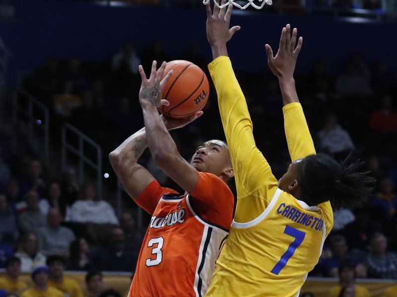 Jan 16, 2024; Pittsburgh, Pennsylvania, USA; Syracuse Orange guard Judah Mintz (3) goes to the basket against Pittsburgh Panthers guard Carlton Carrington (7) during the first half at the Petersen Events Center. Mandatory Credit: Charles LeClaire-USA TODAY Sports