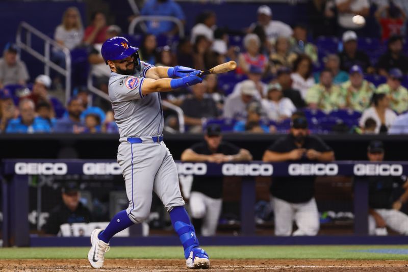 Jul 21, 2024; Miami, Florida, USA; New York Mets catcher Luis Torrens (13) hits a sacrifice fly against the Miami Marlins during the fourth inning at loanDepot Park. Mandatory Credit: Sam Navarro-USA TODAY Sports