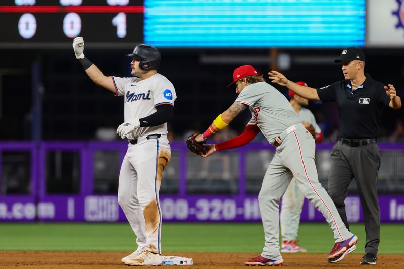 Sep 5, 2024; Miami, Florida, USA; Miami Marlins third baseman Jake Burger (36) reacts from second base after hitting a double against the Philadelphia Phillies during the eighth inning at loanDepot Park. Mandatory Credit: Sam Navarro-Imagn Images