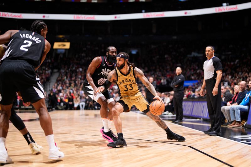 TORONTO, CANADA - JANUARY 26: Gary Trent Jr. #33 of the Toronto Raptors dribbles the ball during the game against the LA Clippers on January 26, 2024 at the Scotiabank Arena in Toronto, Ontario, Canada.  NOTE TO USER: User expressly acknowledges and agrees that, by downloading and or using this Photograph, user is consenting to the terms and conditions of the Getty Images License Agreement.  Mandatory Copyright Notice: Copyright 2024 NBAE (Photo by Mark Blinch/NBAE via Getty Images)