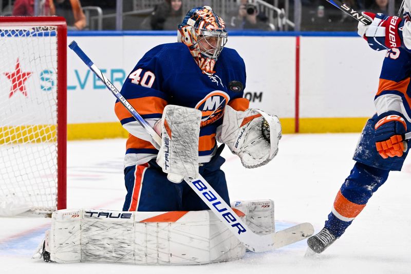 Apr 11, 2024; Elmont, New York, USA; New York Islanders goaltender Semyon Varlamov (40) makes a save against the Montreal Canadiens during the first period at UBS Arena. Mandatory Credit: Dennis Schneidler-USA TODAY Sports