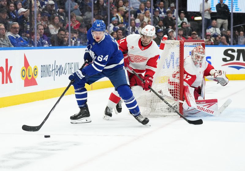 Apr 13, 2024; Toronto, Ontario, CAN; Toronto Maple Leafs center David Kampf (64) controls the puck as Detroit Red Wings defenseman Shayne Gostisbehere (41) tries to defend during the third period at Scotiabank Arena. Mandatory Credit: Nick Turchiaro-USA TODAY Sports