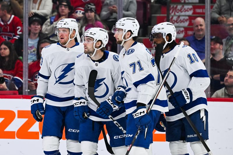 Apr 4, 2024; Montreal, Quebec, CAN; Tampa Bay Lightning left wing Brandon Hagel (38) celebrates his goal against the Montreal Canadiens with his teammates during the second period at Bell Centre. Mandatory Credit: David Kirouac-USA TODAY Sports