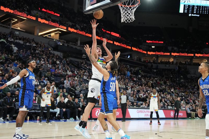 MINNEAPOLIS, MN -  FEBRUARY 3: Luka Garza #55 drives to the basket during the game against the Orlando Magic on February 3, 2023 at Target Center in Minneapolis, Minnesota. NOTE TO USER: User expressly acknowledges and agrees that, by downloading and or using this Photograph, user is consenting to the terms and conditions of the Getty Images License Agreement. Mandatory Copyright Notice: Copyright 2022 NBAE (Photo by Jordan Johnson/NBAE via Getty Images)