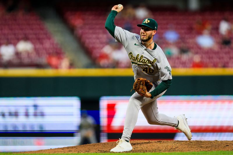 Aug 27, 2024; Cincinnati, Ohio, USA; Oakland Athletics starting pitcher Mitch Spence (40) pitches against the Cincinnati Reds in the sixth inning at Great American Ball Park. Mandatory Credit: Katie Stratman-USA TODAY Sports