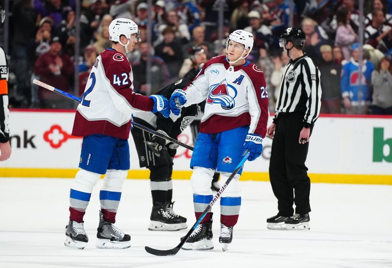 Dec 29, 2025; Denver, Colorado, USA; Colorado Avalanche center Nathan MacKinnon (29) celebrates his empty net goal with defenseman Josh Manson (42) in the third period against the Los Angeles Kings at Ball Arena. Mandatory Credit: Ron Chenoy-Imagn Images