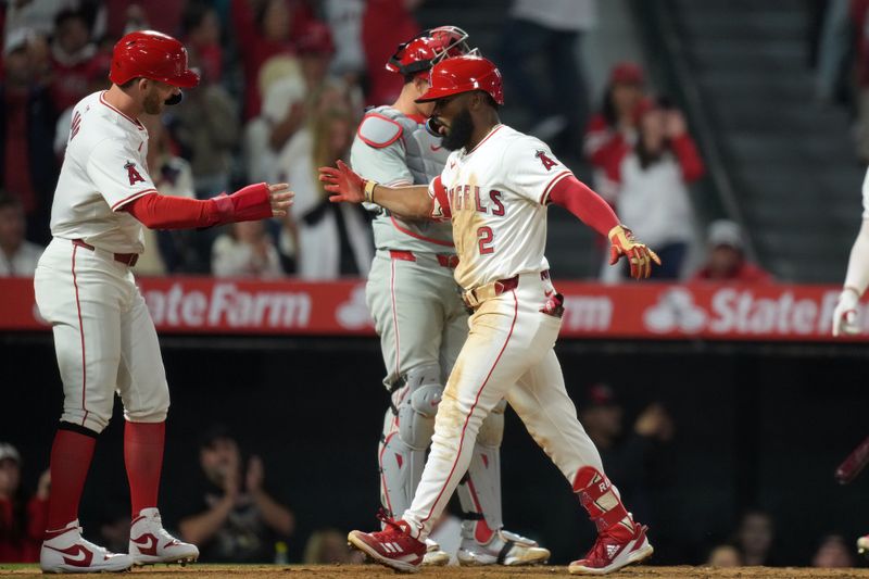 Apr 30, 2024; Anaheim, California, USA; Los Angeles Angels third baseman Luis Rengifo (2) celebrates with left fielder Taylor Ward (3) after hitting a three-run home run in the sixth inning against the Philadelphia Phillies at Angel Stadium. Mandatory Credit: Kirby Lee-USA TODAY Sports