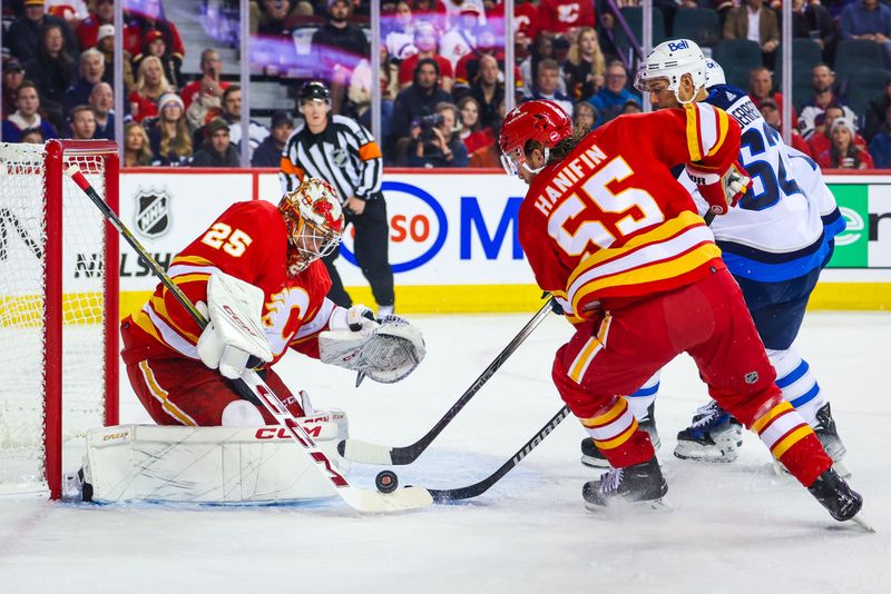 Oct 11, 2023; Calgary, Alberta, CAN; Calgary Flames goaltender Jacob Markstrom (25) makes a save against the Winnipeg Jets during the first period at Scotiabank Saddledome. Mandatory Credit: Sergei Belski-USA TODAY Sports